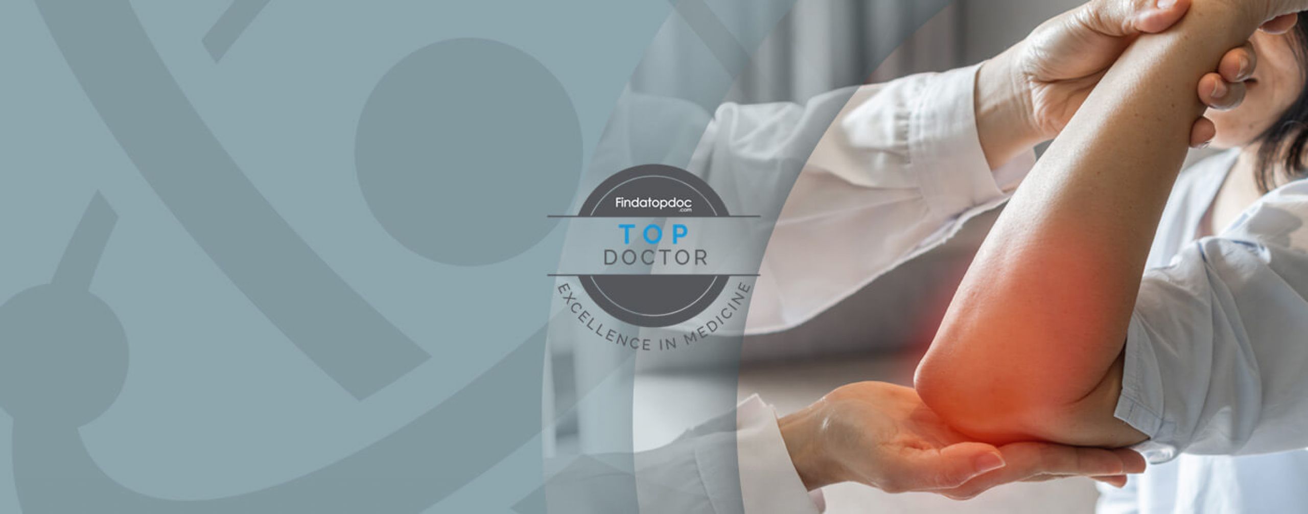 A doctor holds the arm of a patient with elbow pain. Top doctor logo